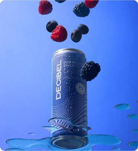 stylized photo of can with berries falling