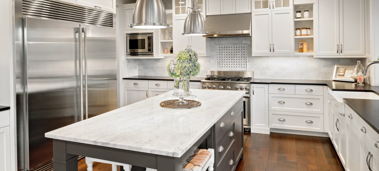 View of a kitchen with a large island